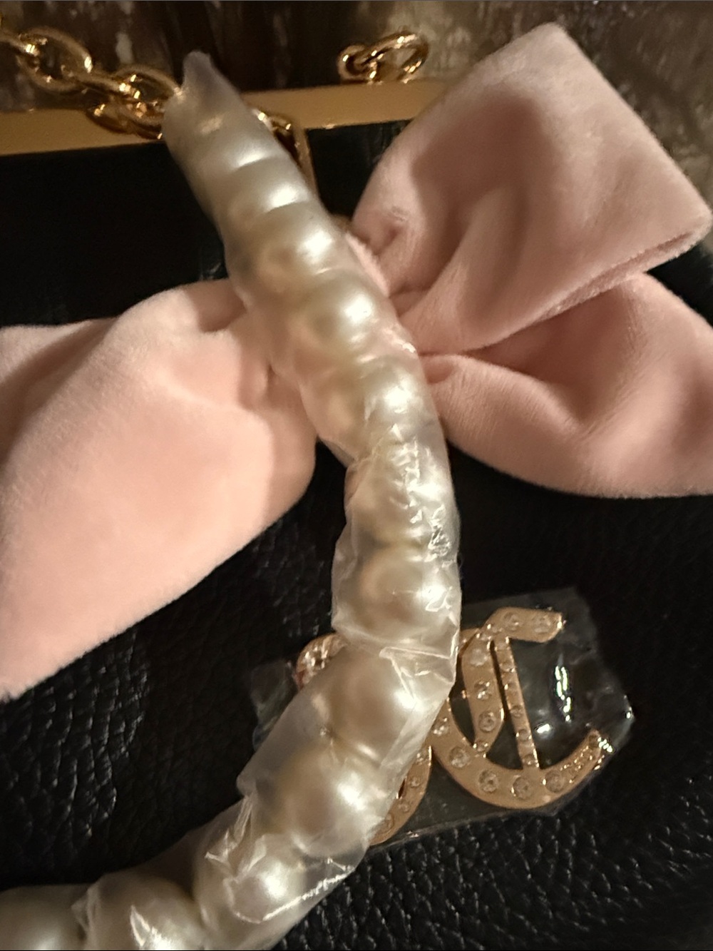 Juicy Couture kisslock handbag w/a prominent blush pink bow and pearl charm.$108 - Picture 10 of 10